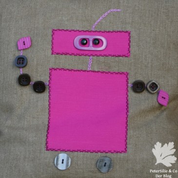 Polster mit Applikationen